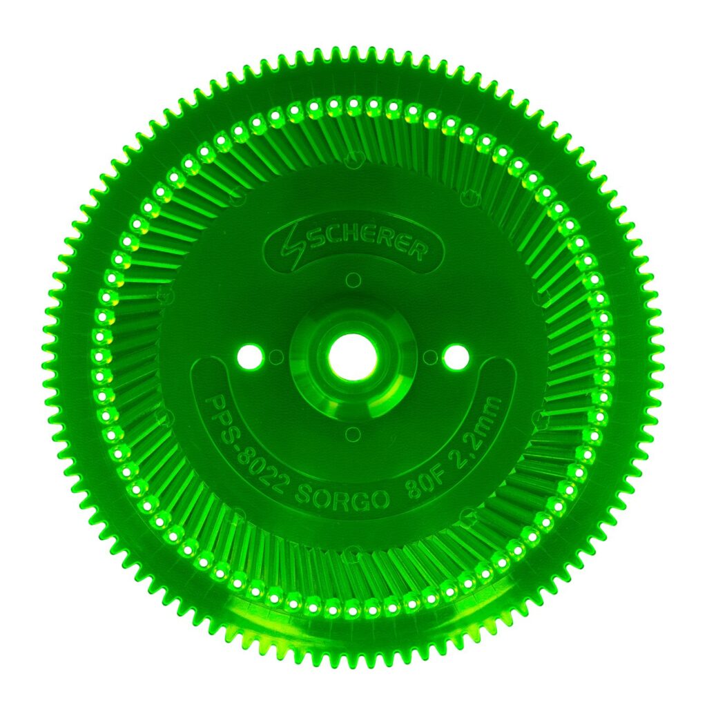 Peça industrial verde iluminada